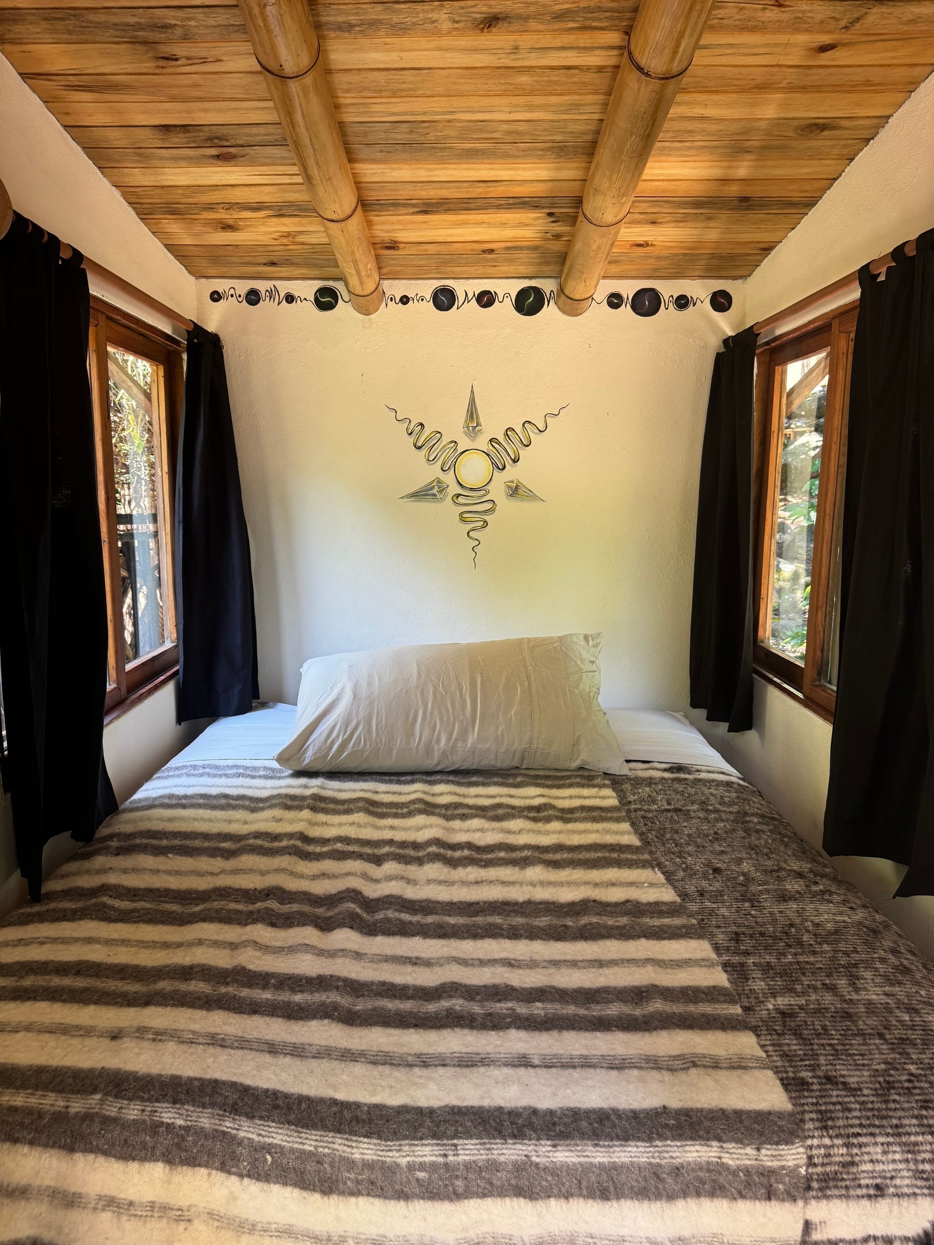 Wooden double bed cabin 1 — dark roof, skylight