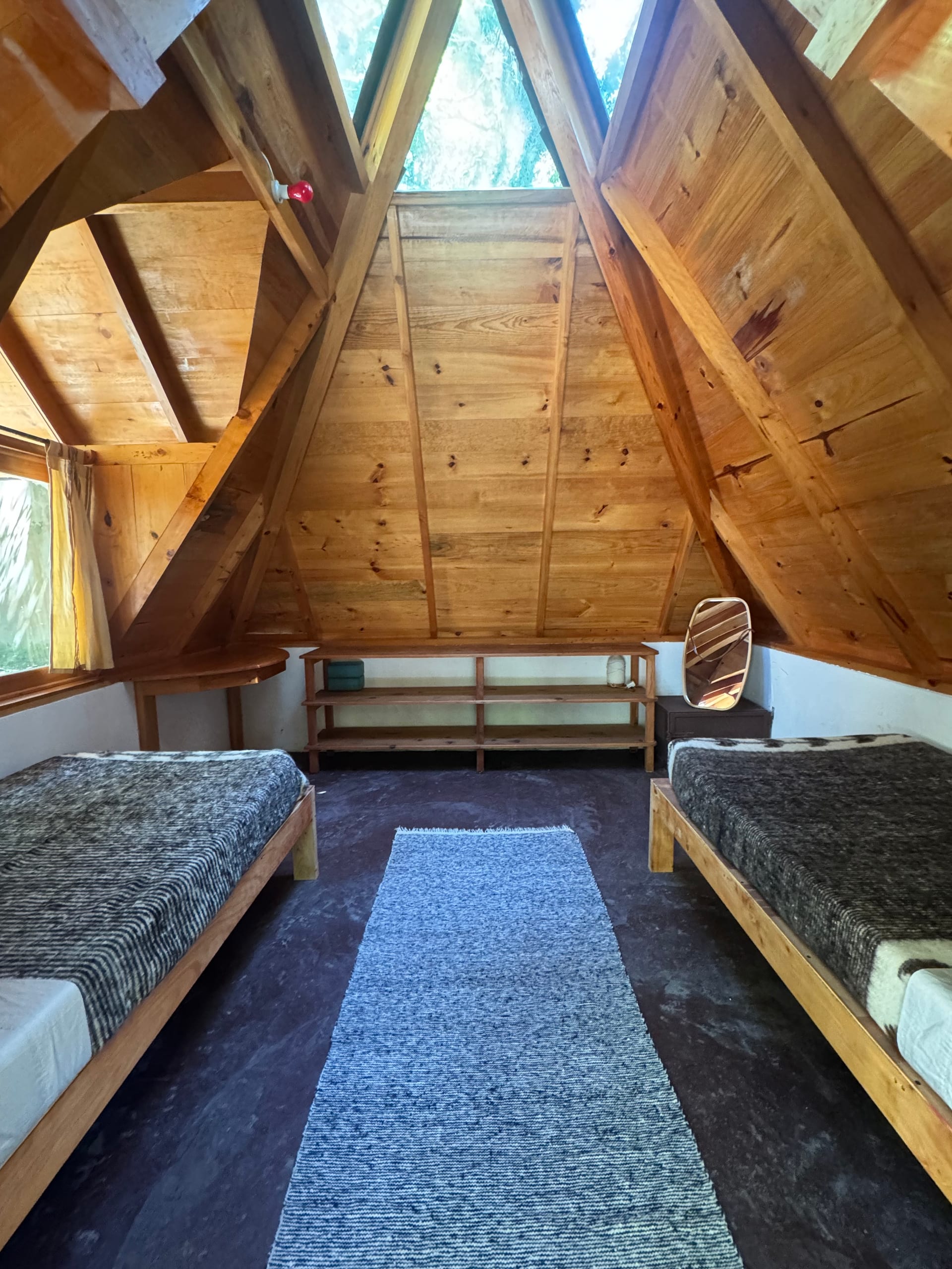 First pyramid cabin — two single beds, A-frame design
